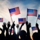 Photo of July 4th revelers holding American flags