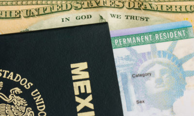 Photo of passport, green card and American money