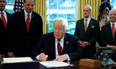 Photo of President Donald Trump signing a water bill