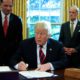 Photo of President Donald Trump signing a water bill