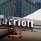 Photo of man working on a Marriott hotel sign