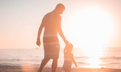 Photo of father and sun on the beach