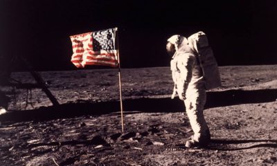 Photo of astronaut Buzz Aldrin posing for a photo beside the US flag on the moon