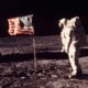 Photo of astronaut Buzz Aldrin posing for a photo beside the US flag on the moon