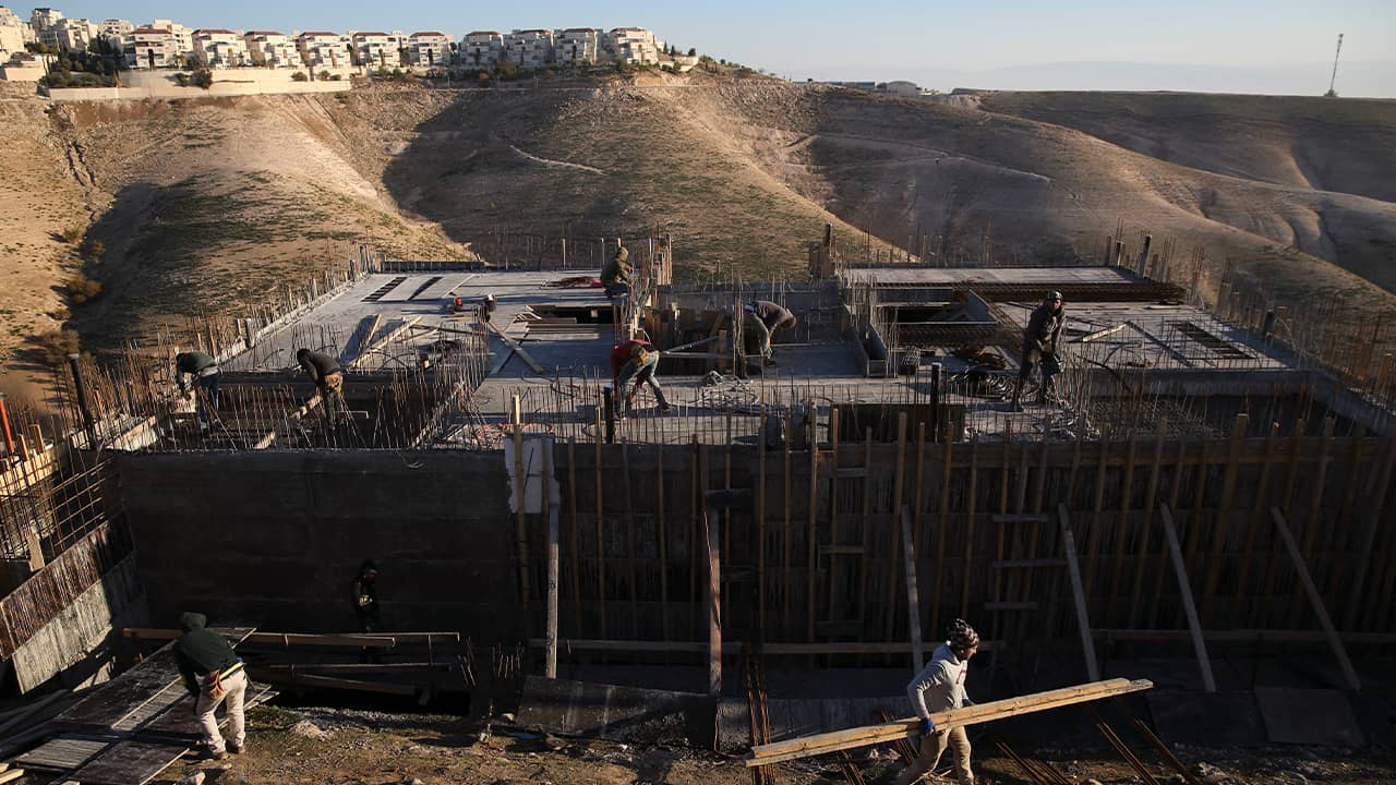 Photo of Palestinian laborers at a construction site