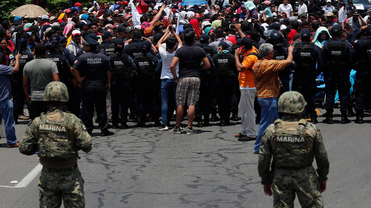 Photo of Mexican authorities stopping a migrant caravan