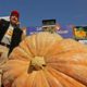 Photo of Leonardo Urena reacting after learning what his pumpkin weighs