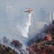 Photo of a helicopter dropping water on the Getty Fire