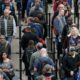 Photo of travelers waiting in line at the Denver International Airport