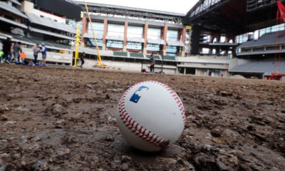 Photo of a baseball on packed dirt