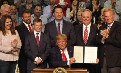 President Donald Trump signs water memo at Bakersfield rally.