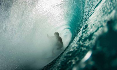 Surfer in the barrel of a wave .