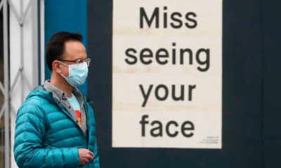 Photo of a man wearing a mask