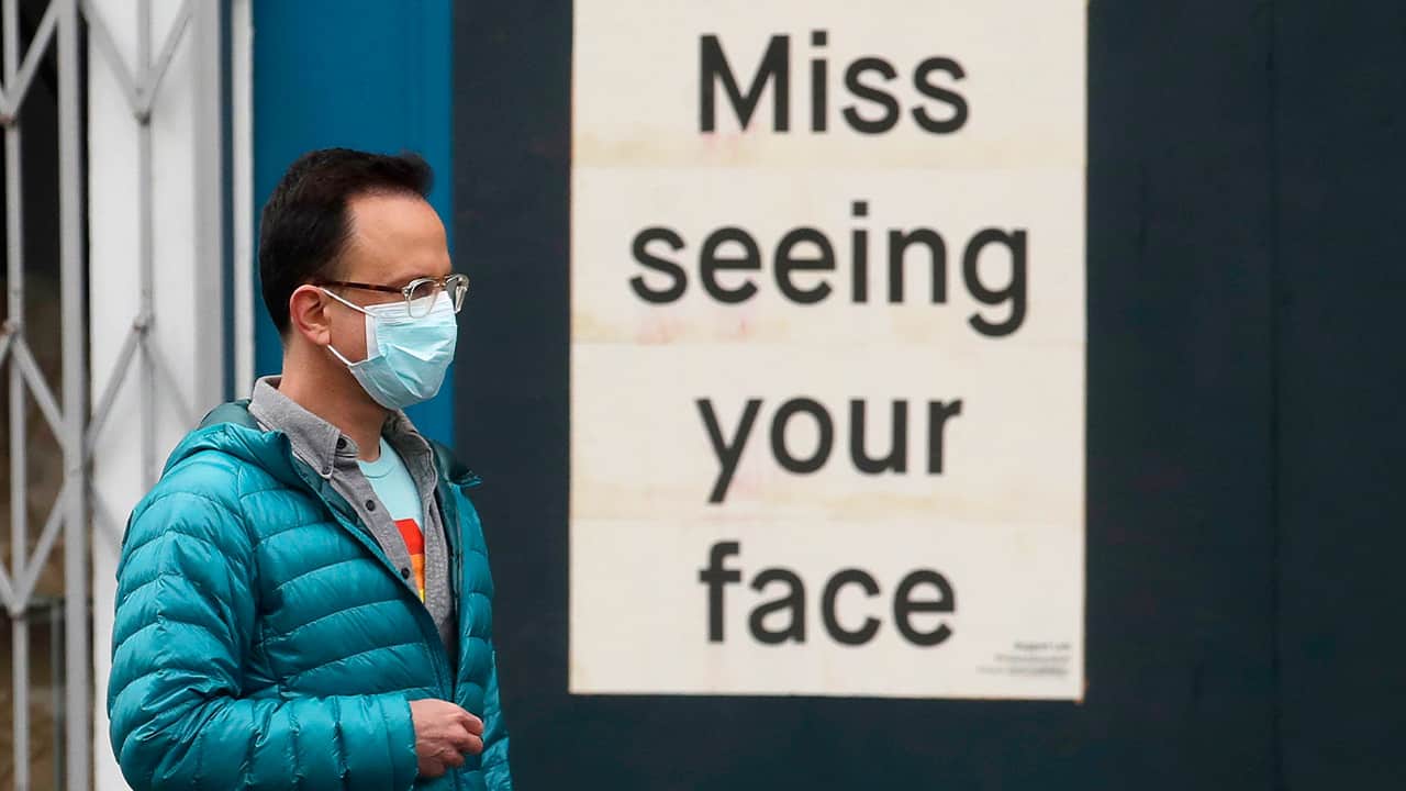 Photo of a man wearing a mask