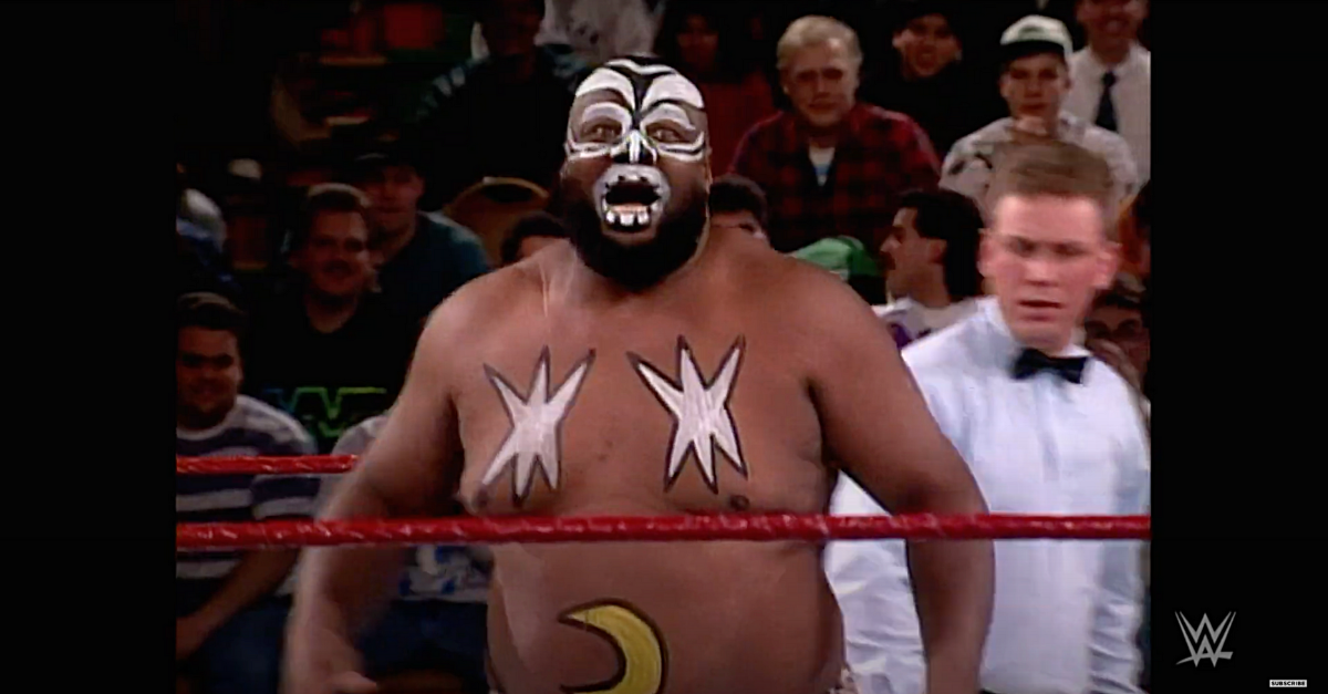 Photo of professional wrestler James "Kamala" Harris in the ring with a referee